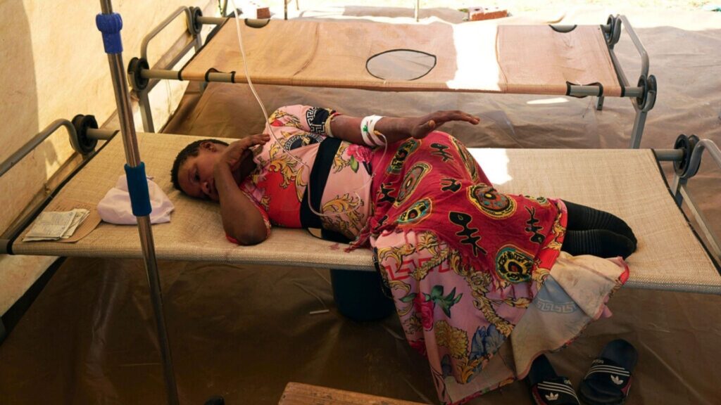 A cholera patient lies on a hospital bed, in Harare, Zimbabwe, Sunday Nov. 19, 2023. A cholera outbreak in Zimbabwe is suspected of killing more than 150 people and infecting more than 8,000.