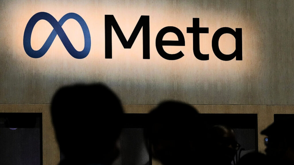 FILE - Attendees visit the Meta booth at the Game Developers Conference 2023 in San Francisco on March 22, 2023.