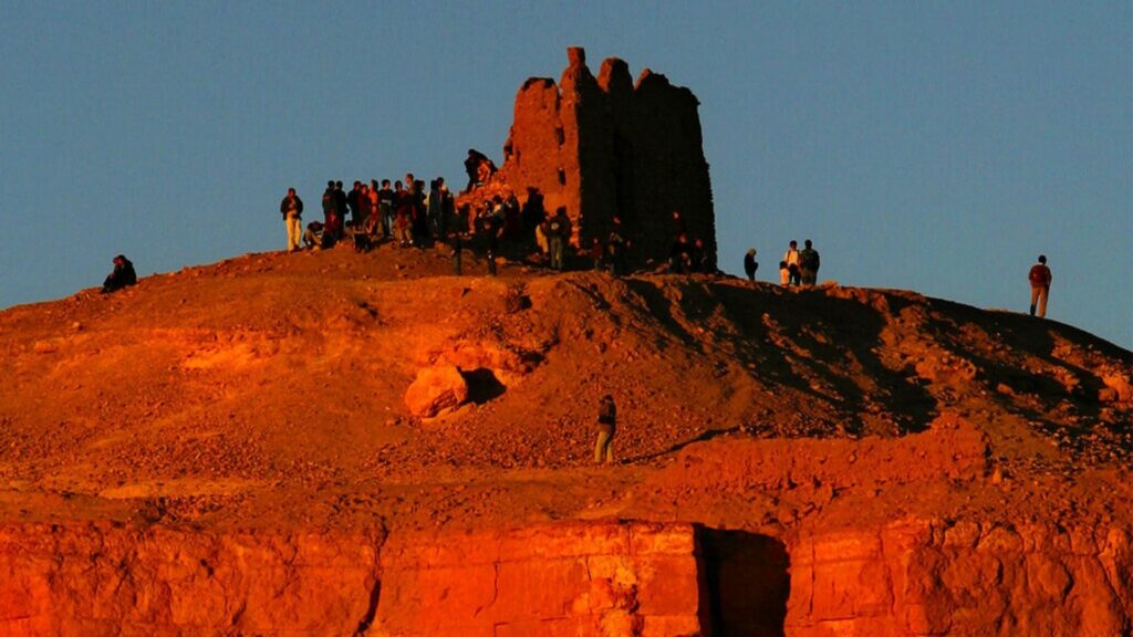 FILE ** Tourists congregate atop of the Ait Ben Haddou fortress, a UNESCO World Heritage site, near Ourzazate, Morocco along what is called the route of a thousand kasbahs in the Atlas Mountains, in this Dec. 31, 2002 file photo.