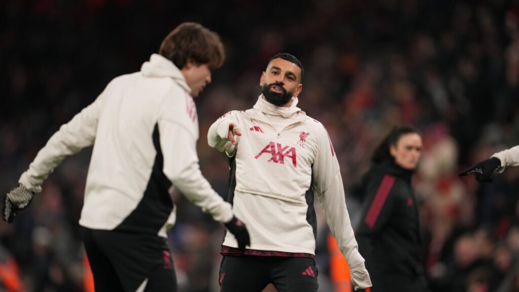 Liverpool's Mohamed Salah, centre, warms up before the English Premier League soccer match between Liverpool and Sunderland in Liverpool, Wednesday, Dec. 3, 2025.