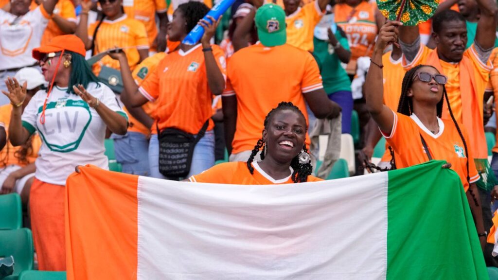 Côte d’Ivoire at 66: Economic powerhouse, but who is benefiting? Ivory Coast 's fans cheer prior the African Cup of Nations final soccer match between Nigeria and Ivory Coast, at the Olympic Stadium of Ebimpe in Abidjan, Ivory Coast, Sunday, Feb. 11, 2024.