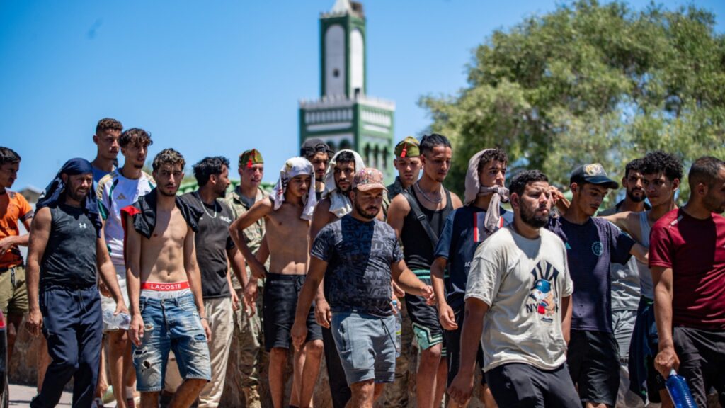 Ceuta migration tragedy sparks death toll dispute between Morocco and Spain Migrants who crossed into Spain are escorted by Spanish soldiers, not pictured, toward the Spanish-Moroccan border for their return to Morocco from the Spanish enclave of Ceuta, Sunday, Aug. 2, 2026.