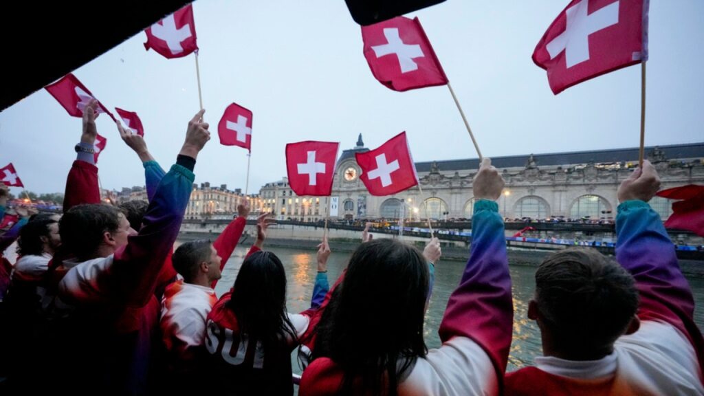 Switzerland tops global prosperity ranking as Mauritius leads Africa in 2026 index Members of Team Switzerland wave their country's flags in Paris, France, during the opening ceremony of the 2024 Summer Olympics, Friday, July 26, 2024.